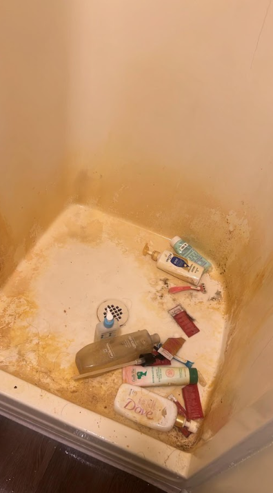 Dirty shower enclosure before cleaning